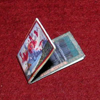 1 inch scale: packet of sewing needles